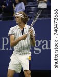 Small photo of NEW YORK - AUGUST 28, 2017: Professional tennis player Alexander Zverev of Germany in action during his 2017 US Open first round match at Billie Jean King National Tennis Center
