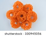 Small photo of Indian jalebis arranged in flower shape in white plate on white background, top view. favorite pastry item in Kerala, India. Dewali sweet, fried crispy dessert. yellow, brown, orange jalebis .