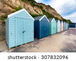a row of beach huts at...