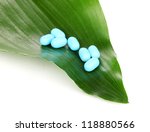 stock-photo-tablets-on-green-leaf-isolated-on-white-118880566.jpg