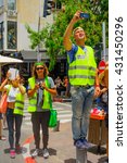 Small photo of TEL-AVIV, ISRAEL - JUNE 03, 2016: Security guards make a break and take photos of the Pride Parade in the streets of Tel-Aviv, Israel. Its part of an annual event of the LGBT community