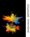 Small photo of Multi cloud blasting powder paint and flour combined, explode in front of a black background to give off fantastic multi color forms.