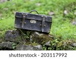 Small photo of old leather carpetbag