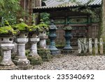 moss covered stone lanterns at...