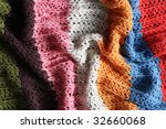 Small photo of a multicolored knitted security blanket