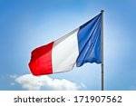 french flag in front of blue...