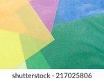 Small photo of colorful translucent construction paper sheets thrown together