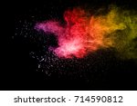 Small photo of Bizarre forms of powder painted and flour combined explode in front of a black background to give off fantastic colors and forms.