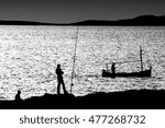 Small photo of C Bresson tribute to the decisive moment, artistic photography in black and white, coast of Ibiza, the sun about to set over the horizon, calm Mediterranean Sea