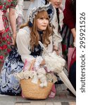 Small photo of TOKYO, JAPAN - JUNE 27, 2015: male cosplay fan in Harajuku district, Tokyo, Japan. Harajuku, especially the Jing?bashi Bridge, is a famous gathering place for cosplayers.