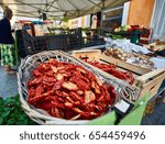 Small photo of Sun dried tomatoes at the rural market. Rural vegetable market in a small Italian town