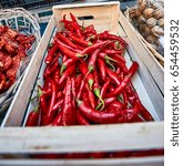 Small photo of Hot chili peppers at the rural market. Rural vegetable market in a small Italian town