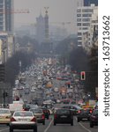 Small photo of APRIL 2012 - BERLIN: traffic during rush hour on the Heerstrasse in the Charlottenburg district of Berlin, in the background the "Siegessaeule" (Victory Column) and Rote Rathaus (CityHall).