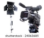 dv-cam camcorder and light in studio - stock photo