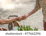 Small photo of Thailand old woman received and paid. Buy the rural market