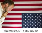 stock-photo-american-upset-political-unrest-and-protest-man-in-deep-thought-in-front-of-an-upside-down-518213242.jpg