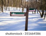 hiking trails sign in winter....