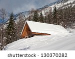 chalet covered with snow in the ...