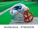 Small photo of ZAGREB , CROATIA - 28 OCTOBER 2015 - New England Patriots NFL club replica helmet at the green playing field , product shot
