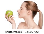 Young woman eat green apple - stock photo