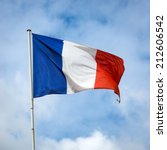 french flag against blue cloudy ...