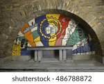 Small photo of BASTOGNE, BELGIUM - AUGUST 25, 2016: The crypt with the mosaics by Fernand Leger of Mardasson military memorial commemorating american casualties of battle of the bulge at the end of second world war