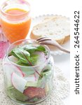 Small photo of New yorker food, jar salad and carrot juice with bread for healthy breakfast image