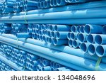 stock-photo-pvc-pipes-stacked-in-construction-site-134048696.jpg