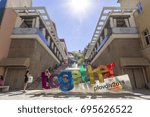 Small photo of PLOVDIV, BULGARIA - JULY 30: Tourists pass along European Capital of Culture 2019 "Together" slogan in Plovdiv, on July 30, 2017, Bulgaria.