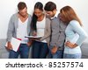 Some students learning together in a university hall - stock photo