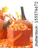 Halloween candy corn and pumpkin for holiday decoration  - stock photo