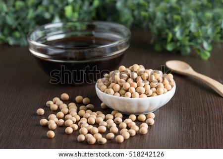 Soy bean with soy sauce on wood table.
