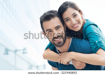 https://thumb9.shutterstock.com/display_pic_with_logo/101595/321940892/stock-photo-closeup-shot-of-young-man-carrying-young-woman-on-his-back-happy-smiling-couple-looking-at-camera-321940892.jpg