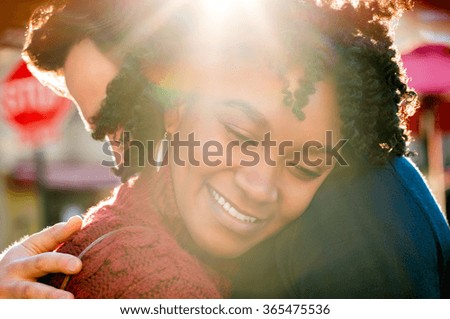 https://thumb9.shutterstock.com/display_pic_with_logo/101595/365475536/stock-photo-happy-young-african-woman-hugging-man-in-a-bright-sunny-day-close-up-face-of-young-girl-embracing-365475536.jpg