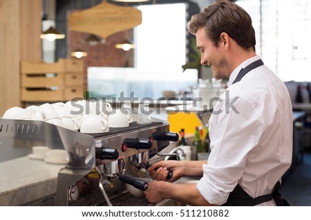 Young Waiter Making Coffee At Shop Happy Barman Poring From Machine Young Waiter Making Coffee At Shop Happy Barman Poring From Machine