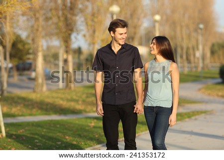 https://thumb9.shutterstock.com/display_pic_with_logo/1020994/241353172/stock-photo-happy-couple-laughing-while-taking-a-walk-in-a-park-241353172.jpg