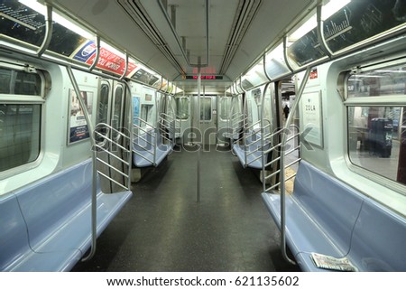 NEW YORK - APRIL 4, 2017: Inside of NYC Subway Car at Eighth Avenue Station in Manhattan. Owned by the NYC Transit Authority, the subway system has 469 stations in operation