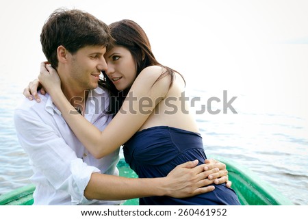 https://thumb9.shutterstock.com/display_pic_with_logo/1028596/260461952/stock-photo-happy-couple-in-love-on-boat-in-vacation-260461952.jpg