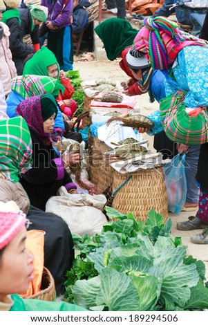 HAGIANG, VIETNAM, FEBRUARY 16: Unidentified ethnic minority women in a traditional market on February 16, 2014 in HaGiang, Vietnam. Ha Giang is a northernmost province in Vietnam
