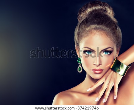 fashion woman with jewelry . girl with the hair ban and fashionable jewelry , earrings ,bracelets