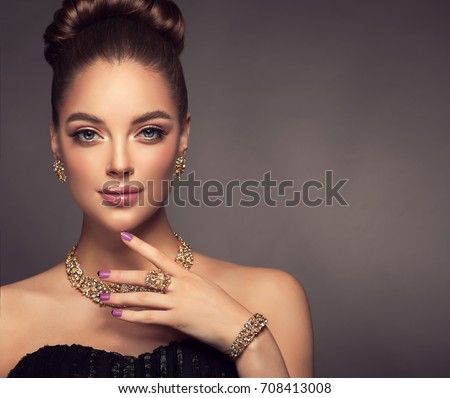 https://thumb9.shutterstock.com/display_pic_with_logo/1054231/708413008/stock-photo-beautiful-girl-with-jewelry-a-set-of-jewelry-for-woman-necklace-earrings-and-bracelet-beauty-708413008.jpg