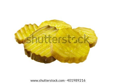 Closeup of sliced pickles on white background