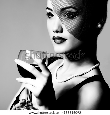 Portrait of beautiful young woman with wine glass black and white retro stylization Portrait of beautiful young woman with wine glass black and white retro stylization
