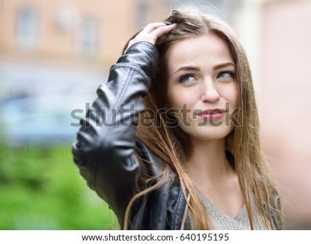 https://thumb9.shutterstock.com/display_pic_with_logo/111616/640195195/stock-photo-young-attractive-woman-standing-in-the-rain-directing-her-face-to-the-drops-girl-in-rainy-day-gets-640195195.jpg