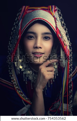 https://thumb9.shutterstock.com/display_pic_with_logo/1133222/754353562/stock-photo-portrait-of-beautiful-young-asian-lady-akha-tribe-akha-hill-picking-arabica-coffee-berries-in-red-754353562.jpg