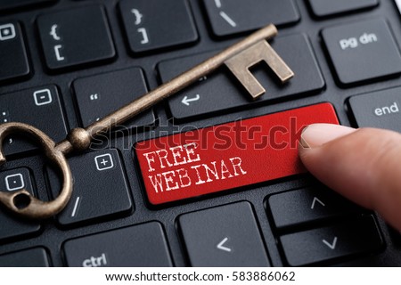 closed up finger on keyboard with word free webiner