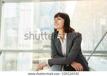 Portrait of happy business woman looking confident