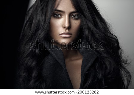 Fashion portrait of a sensual brunette girl with curly <b>long black hair</b>. - stock-photo-fashion-portrait-of-a-sensual-brunette-girl-with-curly-long-black-hair-200123282