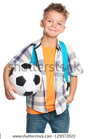 Happy schoolboy with backpack and soccer ball isolated on white background