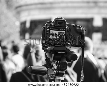 PARIS, FRANCE - OCTOBER 3, 2015: Canon camera shooting Zombie parade taking place at Place de la Republique. Zombie Walk is an annual event in Paris.